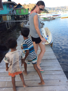 Kids strolling along the boardwalk with a couple of chickens